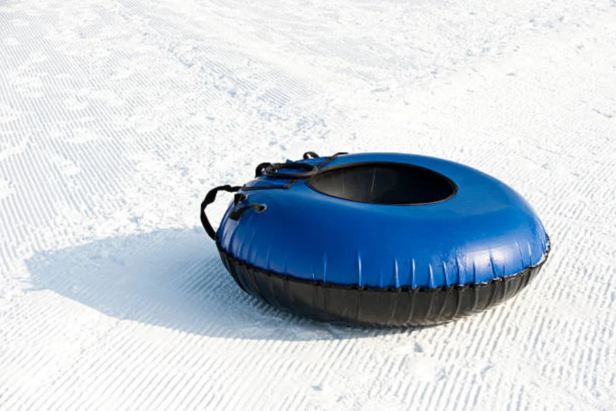 Blue inflatable snow tube for adults with black bottom
