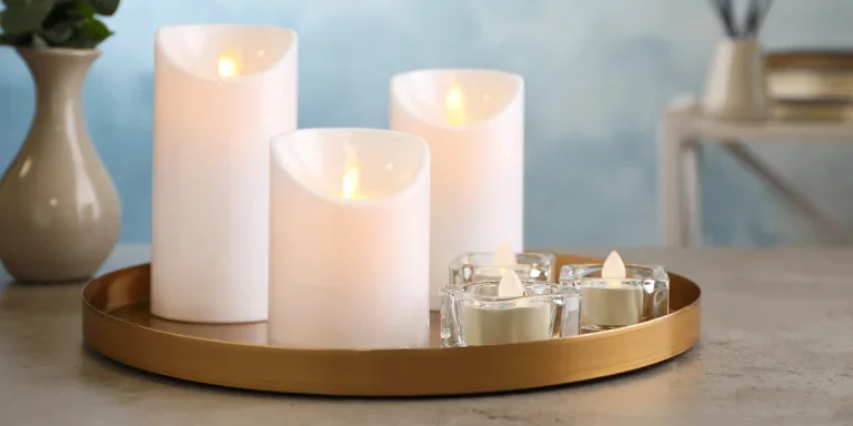 Decorative LED candles in a tray on a table