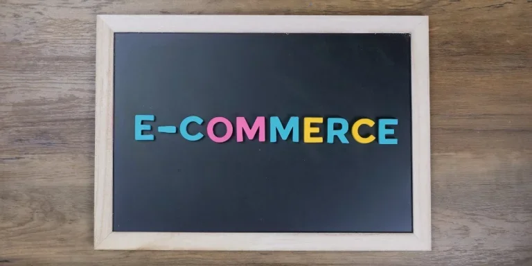 e-commerce sign on black background board
