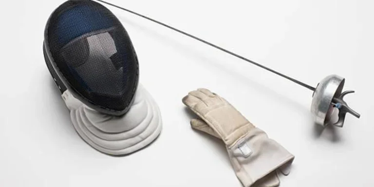 Fencing equipment (sword, mask, glove) on a white background