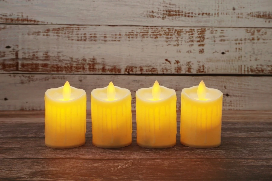 Flameless candles on a wooden background