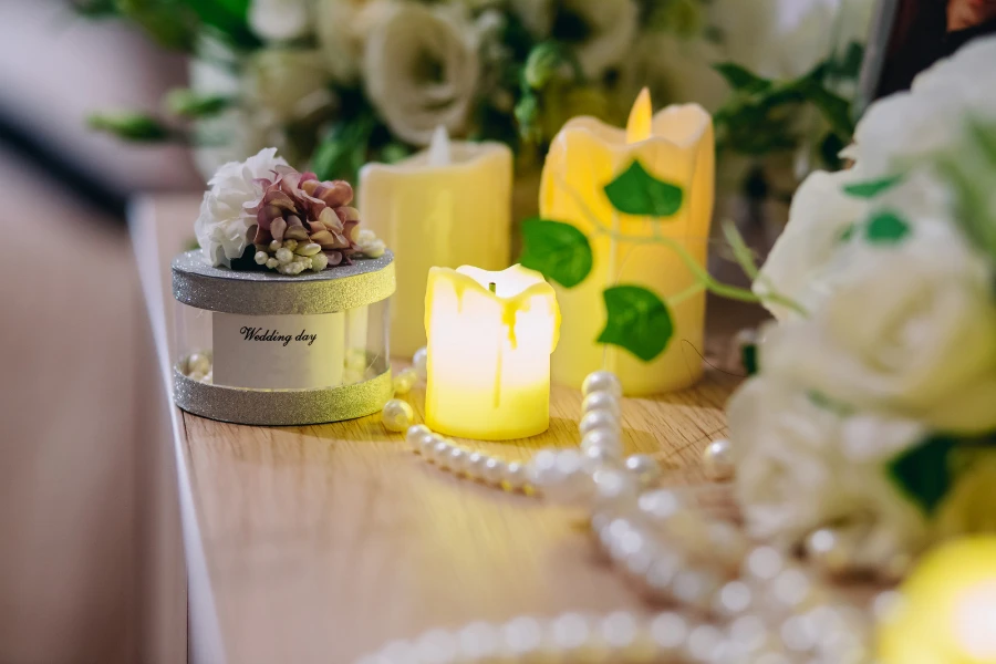 Flameless wedding souvenir candles on a table