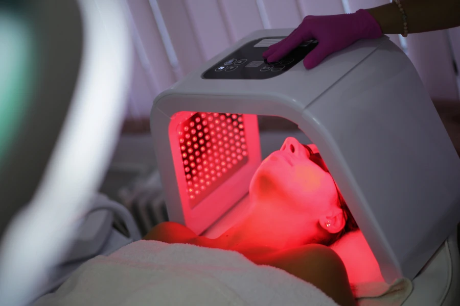 Lady receiving red light therapy treatment