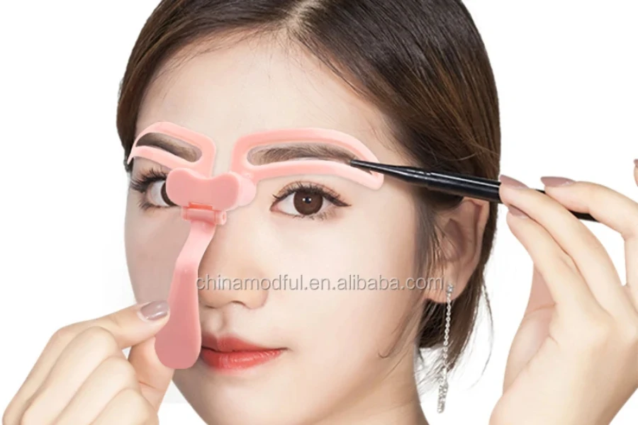 Lady using a pink eyebrow stencil