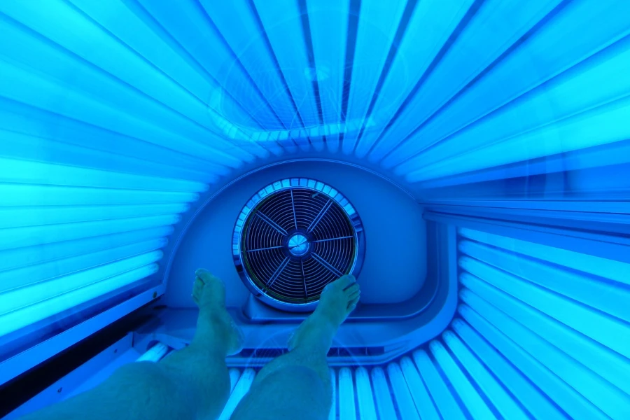 Person lying down in a tanning bed
