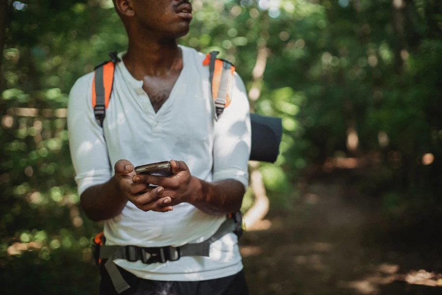 Person navigating outdoors with a GPS