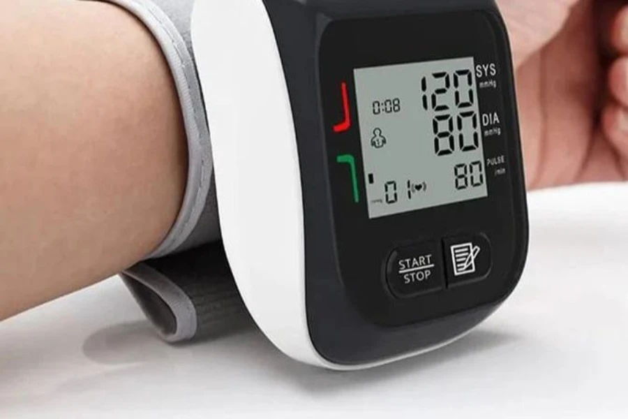 Person using a wearable blood pressure monitor
