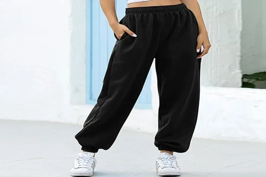 Person wearing black, oversized sweatpants