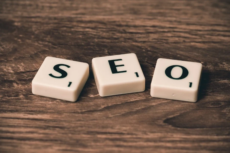 Scrabble letters spelling SEO on a wooden table