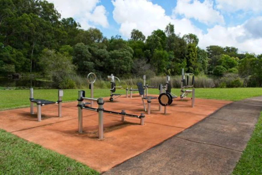 Small outdoor fitness gym in the middle of grassy park