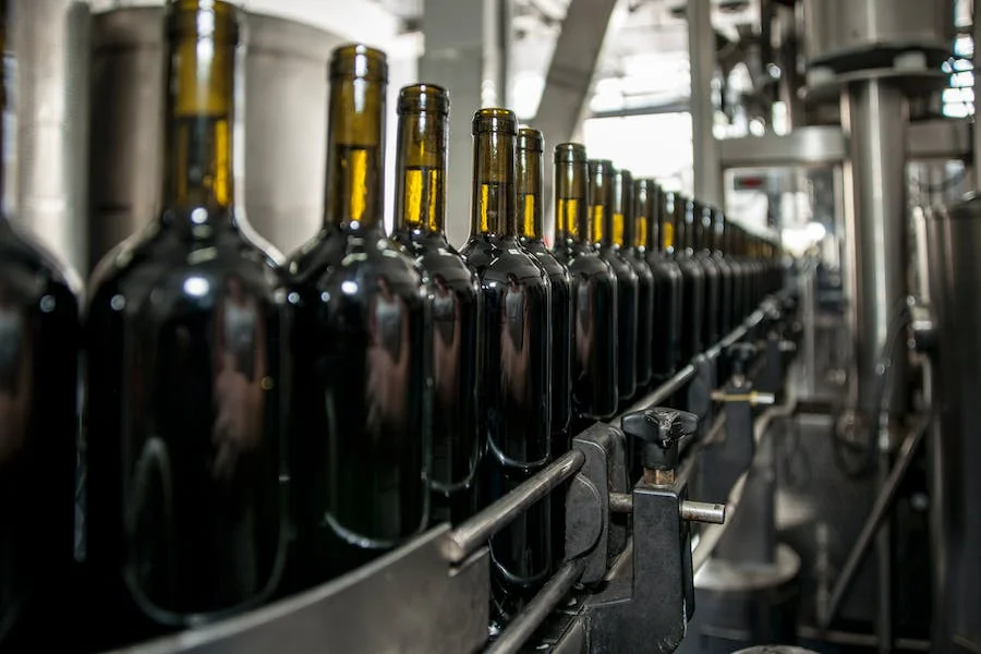 Wine bottles on an industrial machinery