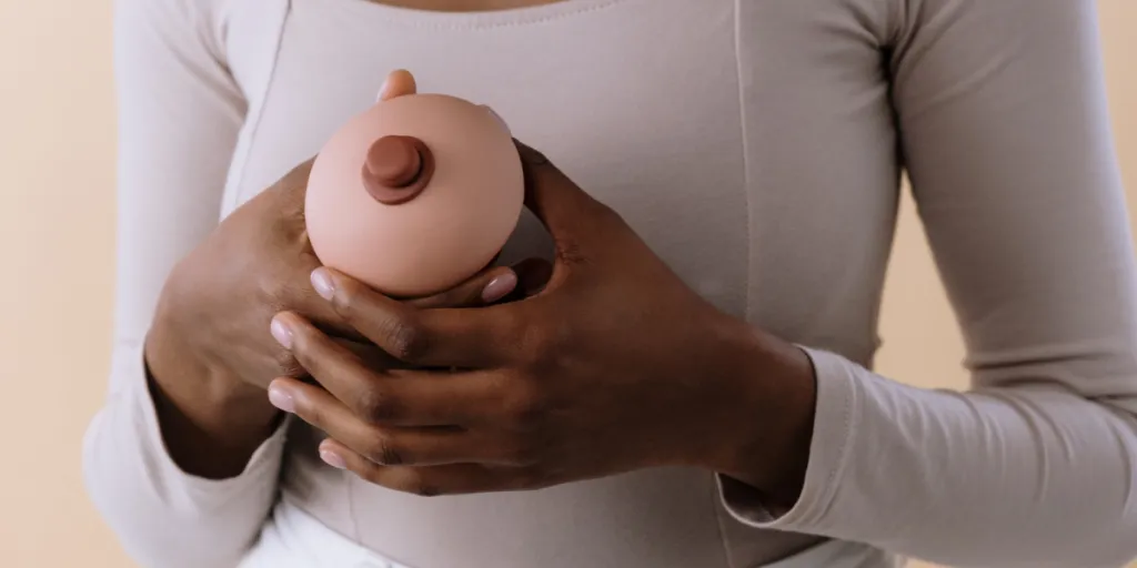 Woman holding a single breast form