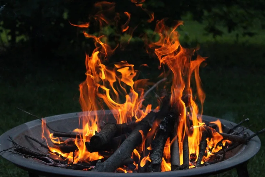 Wood burning in an outdoor fire pit