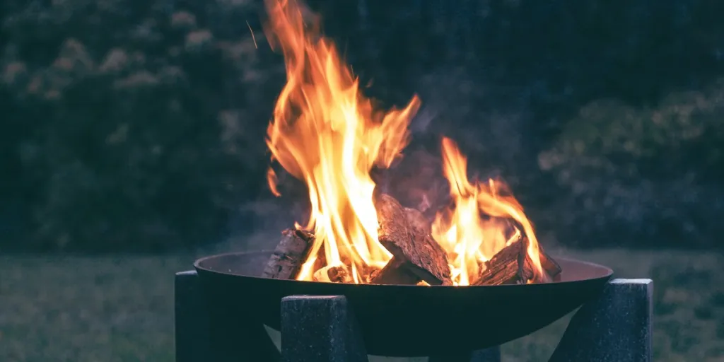 Wood burning in an outdoor fire pit
