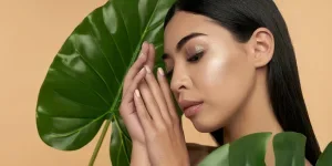 A beautiful woman holding leaves