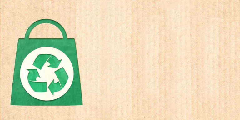 Arrows recycle symbol and shopping bag in paper cut style