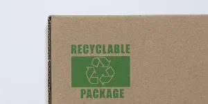 Cardboard pakage with recycling symbol