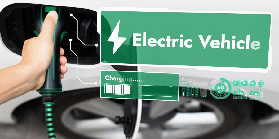Mobil listrik dicolokkan dengan stasiun pengisian untuk mengisi ulang baterai