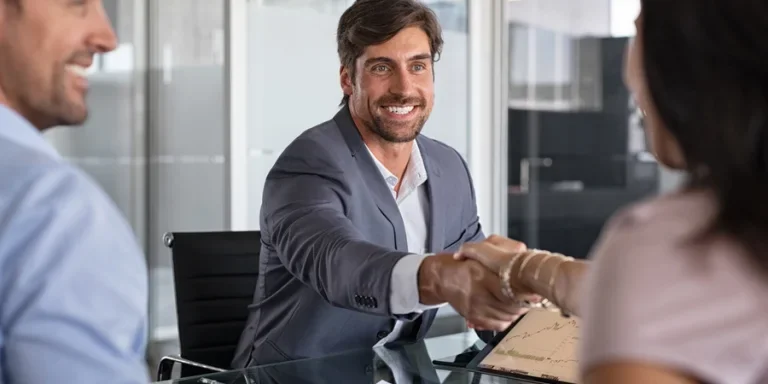 Financial advisor shaking hand to seal a deal