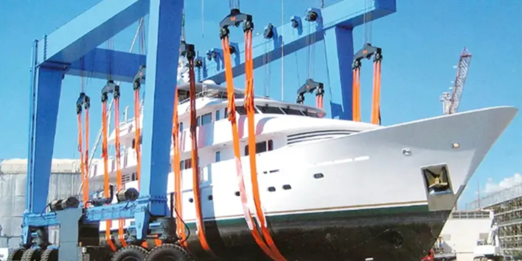a 1000-ton boat gantry crane lifting a luxury yacht