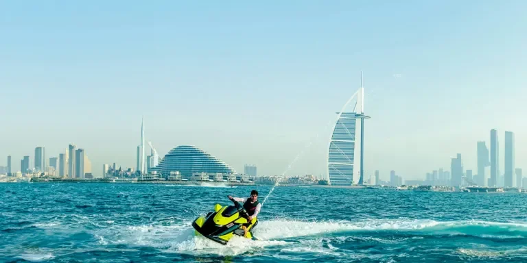 a man riding a jet ski on top of a body of water