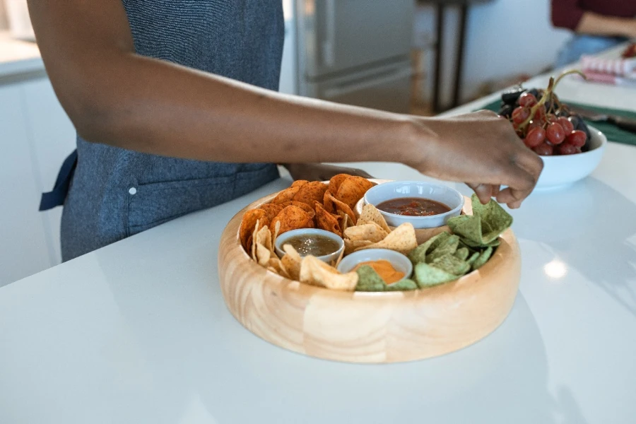 A person decorating a platter