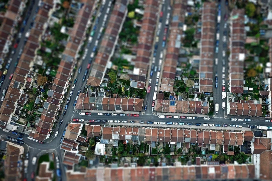 An aerial view of a neighborhood with houses that have solar panels