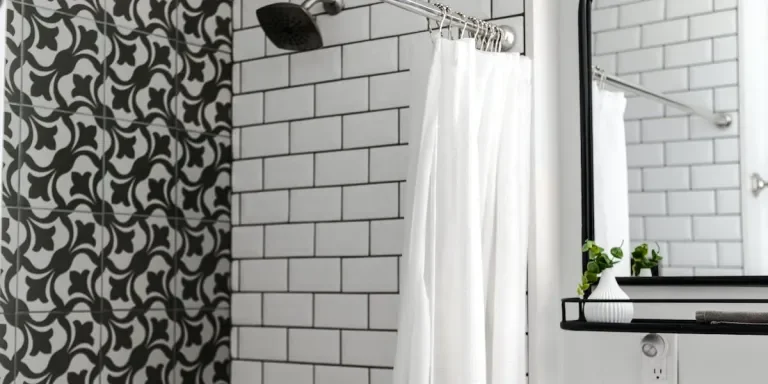 bathroom with a white shower curtain with hooks