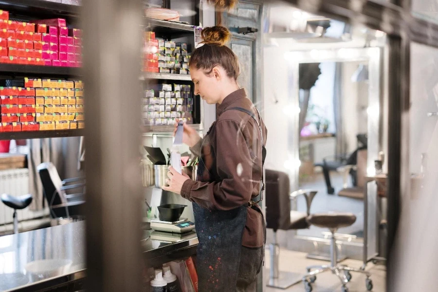 Female beautician doing a routine check in her salon