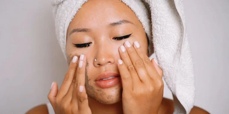 Lady exfoliating with a facial scrub