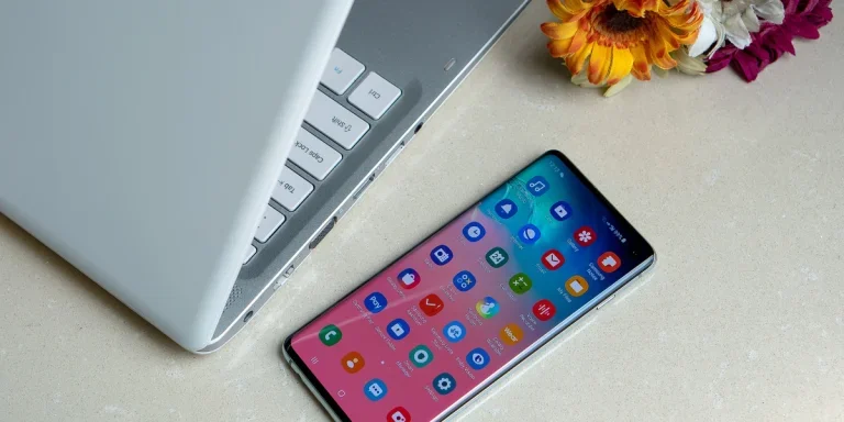 Laptop and cell phone on the desk