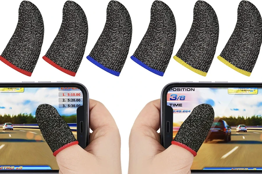 Mobile phone user playing games with finger sleeves