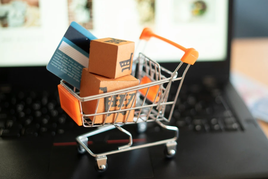 Packages and credit card in a toy shopping cart