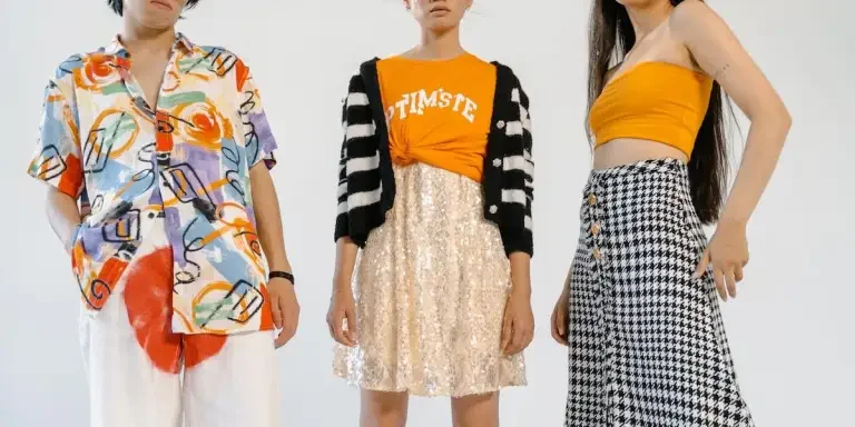 People wearing stylish outfits on a white background