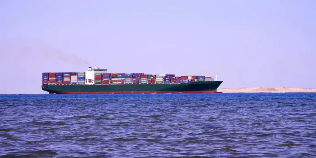Red sea, a large cargo ship sails on the sea