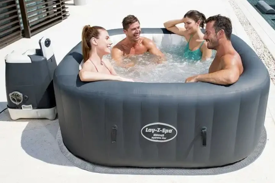 Small inflatable pool spa with four people inside