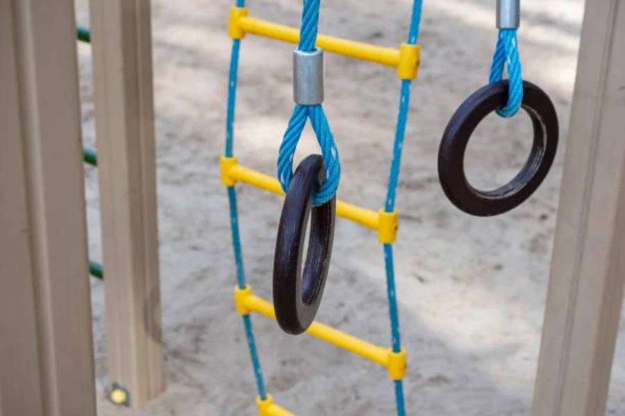 Still rings at a sandy outdoor playground