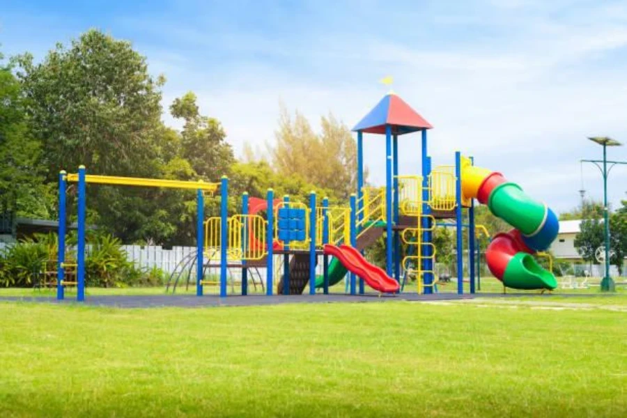 Vibrant-colored outdoor playground equipment in a lush green park