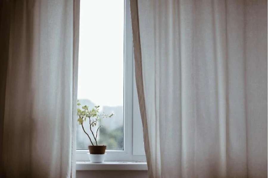 Window with beige sheer drapes