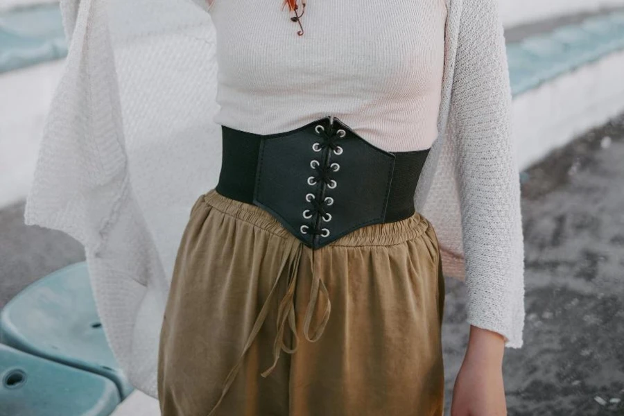Woman in black lace corset belt