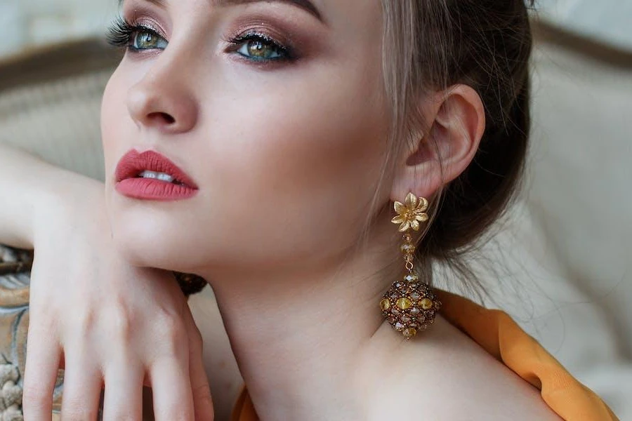 Woman posing with eye-catching earrings
