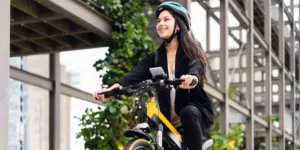 Woman smiling while riding an electric bicycle