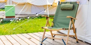 Wooden heavy duty camping chair with green fabric