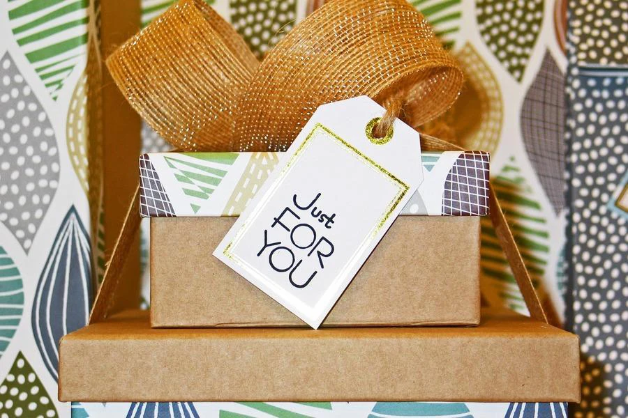 A close-up photo of gift boxes with a greeting card