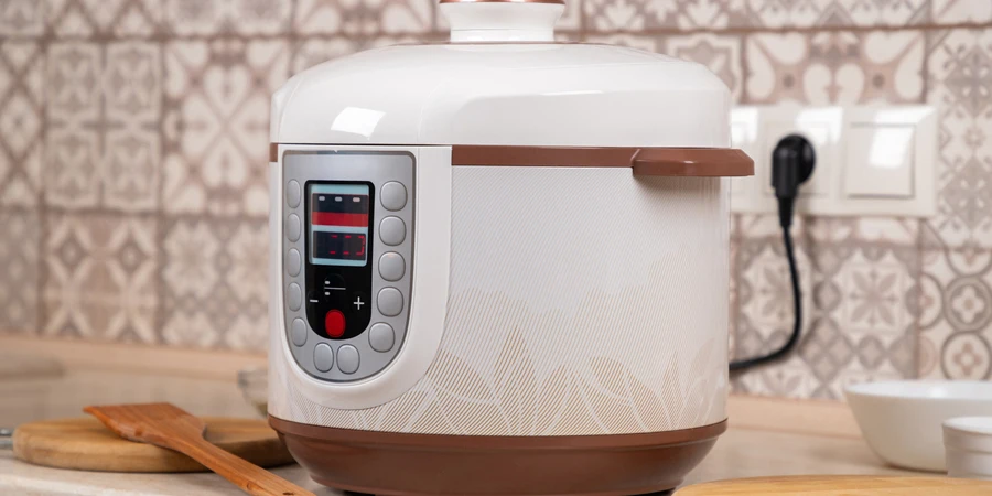 A modern electric multi cooker on a table