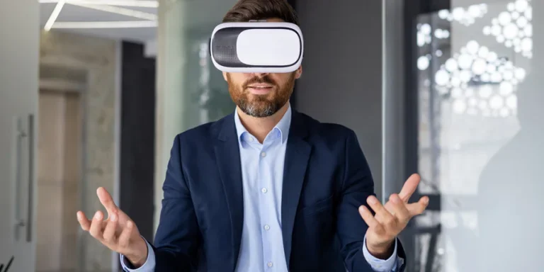 A young man sits in the office at the table in front of the camera in a virtual online mask