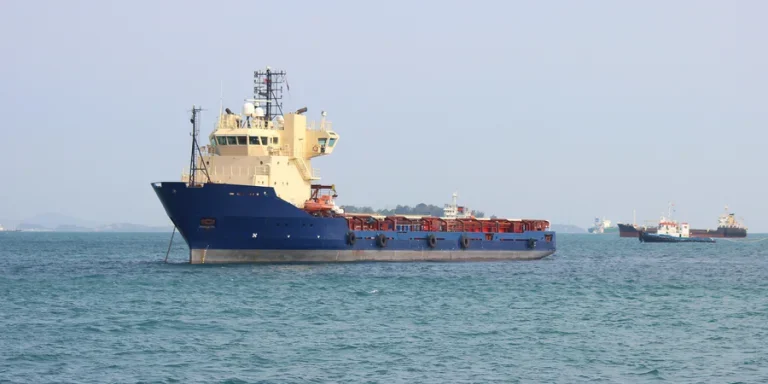 Cargo ships sail in the waters around Singapor