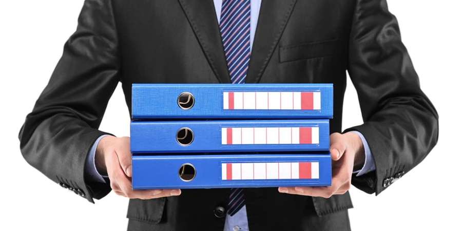 Close up of a businessman holding folders