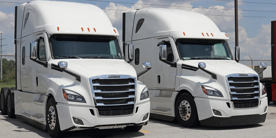 Freightliner Semi Tractor Trailer Trucks Lined up for Sale