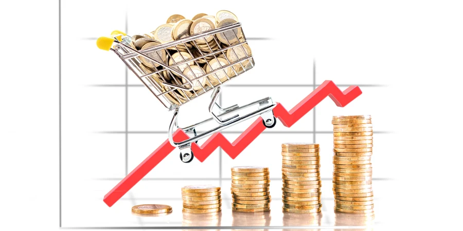 Gráfico en torres de monedas que muestra la subida del precio del carrito de la compra.